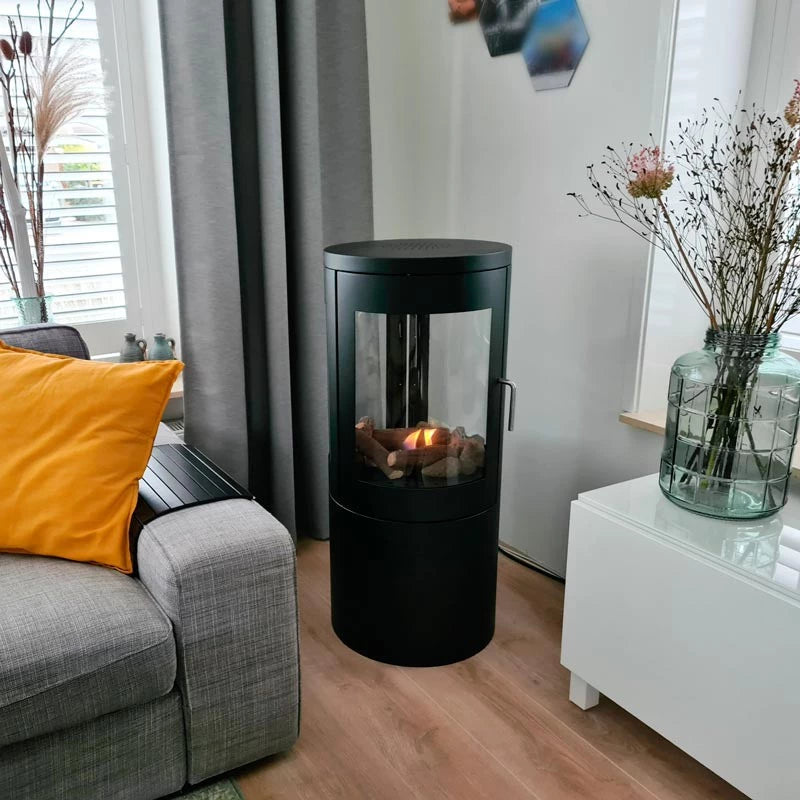 Columbus Bioethanol stove with 360-degree view, stylishly placed in a modern living room setting.
