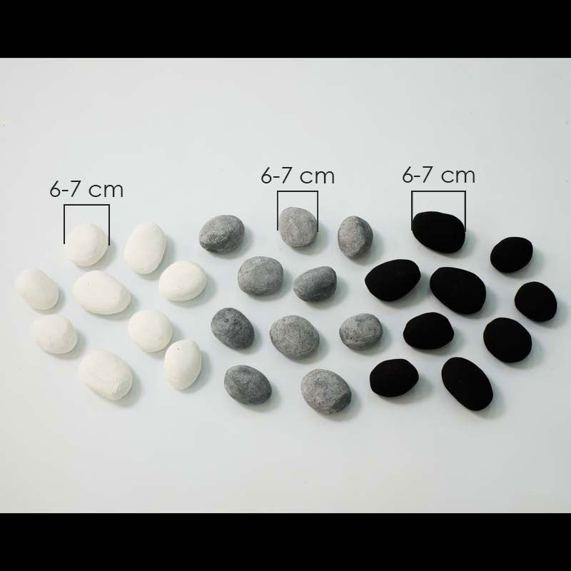 Mixed ceramic pebbles in white, grey, and black, each measuring 6-7 cm, ideal for decorative use.