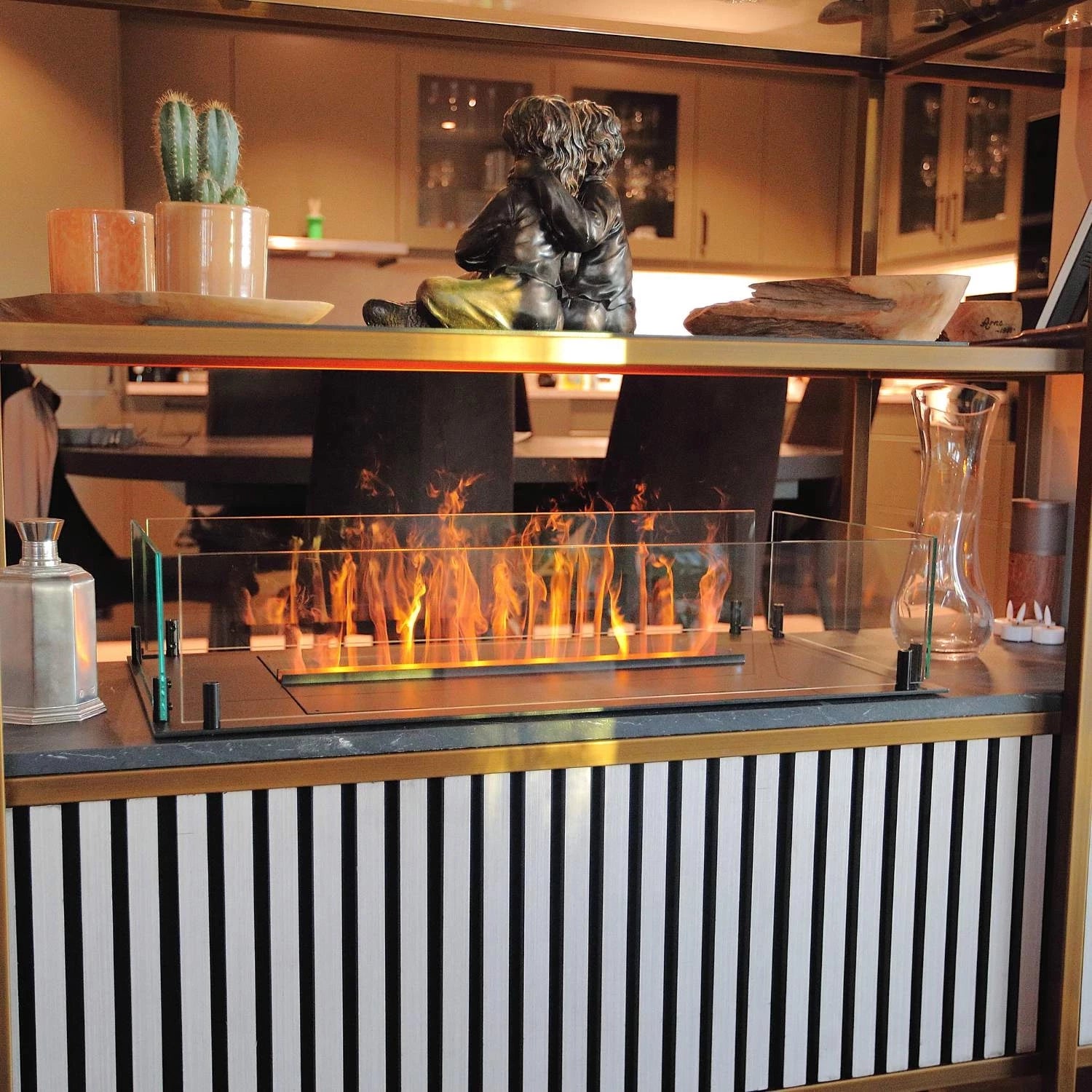 Modern Foco Myst Free 800 water vapour fireplace creating a cozy ambiance in a stylish living space.