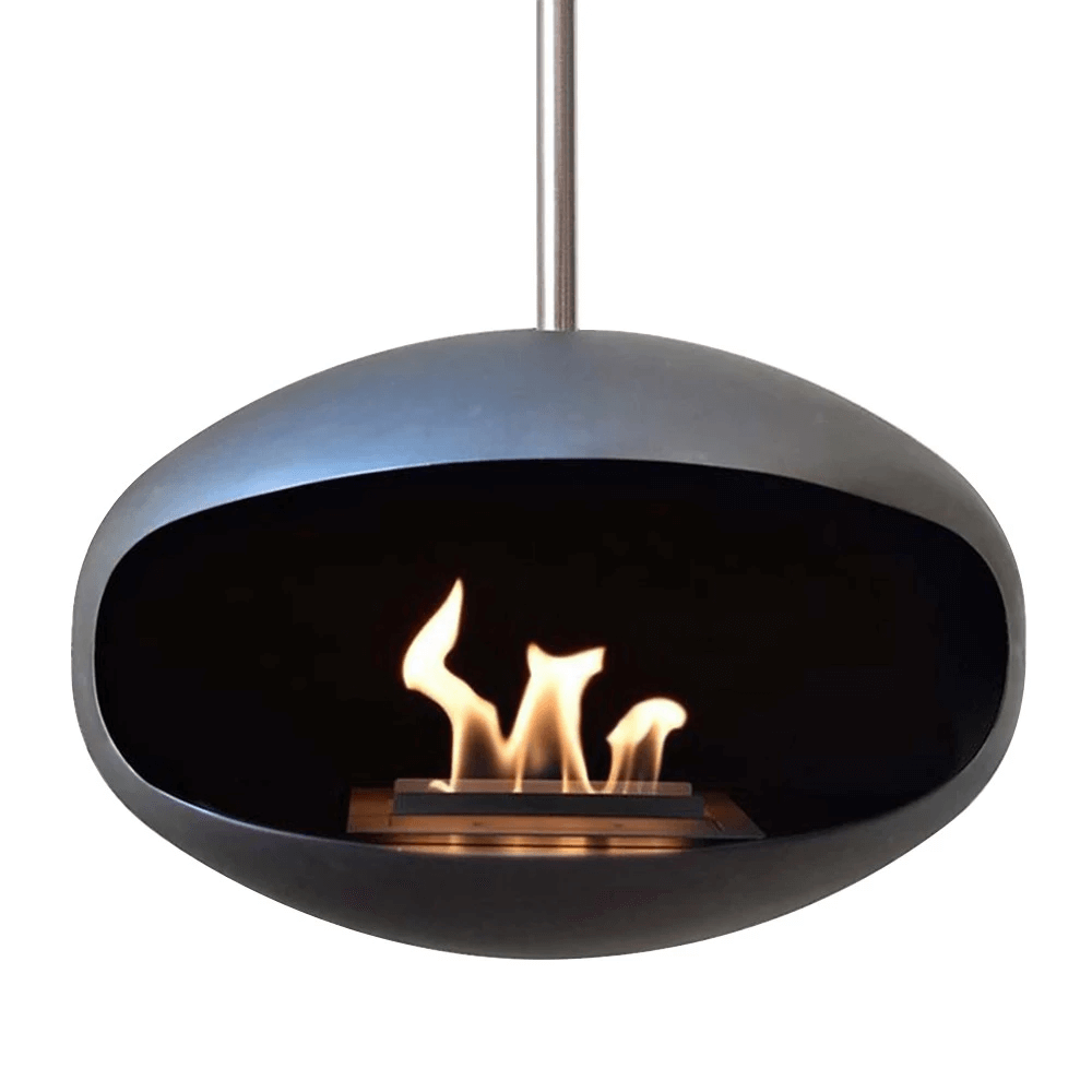 Cocoon Aeris black bioethanol fireplace with stainless steel pole, featuring a modern design and flames burning.