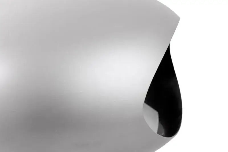 Close-up of the Le Feu Dome Wall Bio Ethanol Fireplace in nickel finish, showcasing its sleek design and elegant edges.