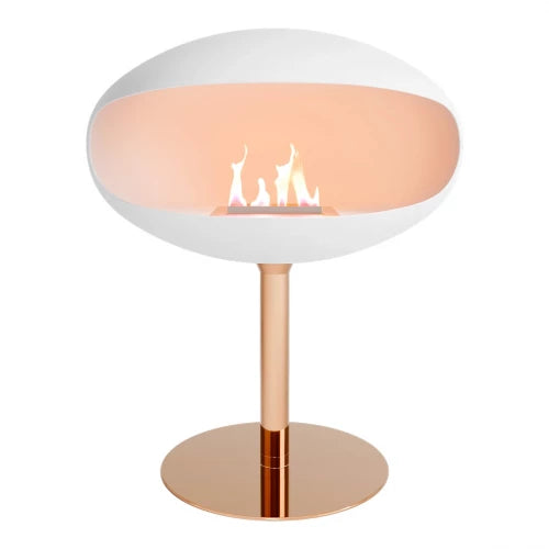 Cocoon Pedestal White bioethanol fireplace with copper pedestal, featuring a sleek matte finish and visible flames.